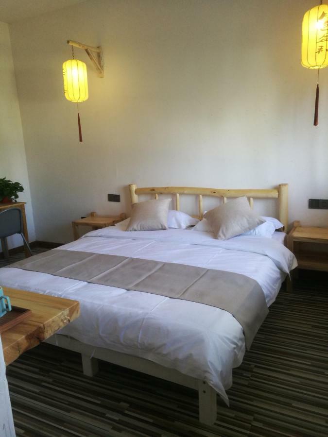 Right Here Hotel Dunhuang Bagian luar foto